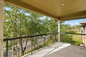 Large balcony with black railing